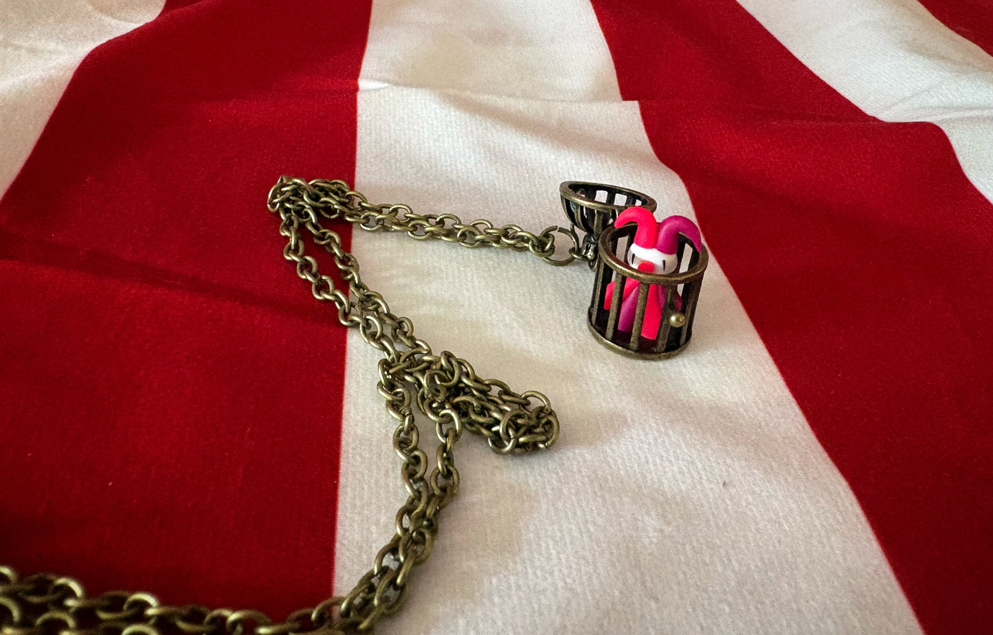 Tiny Caged Clown Necklace