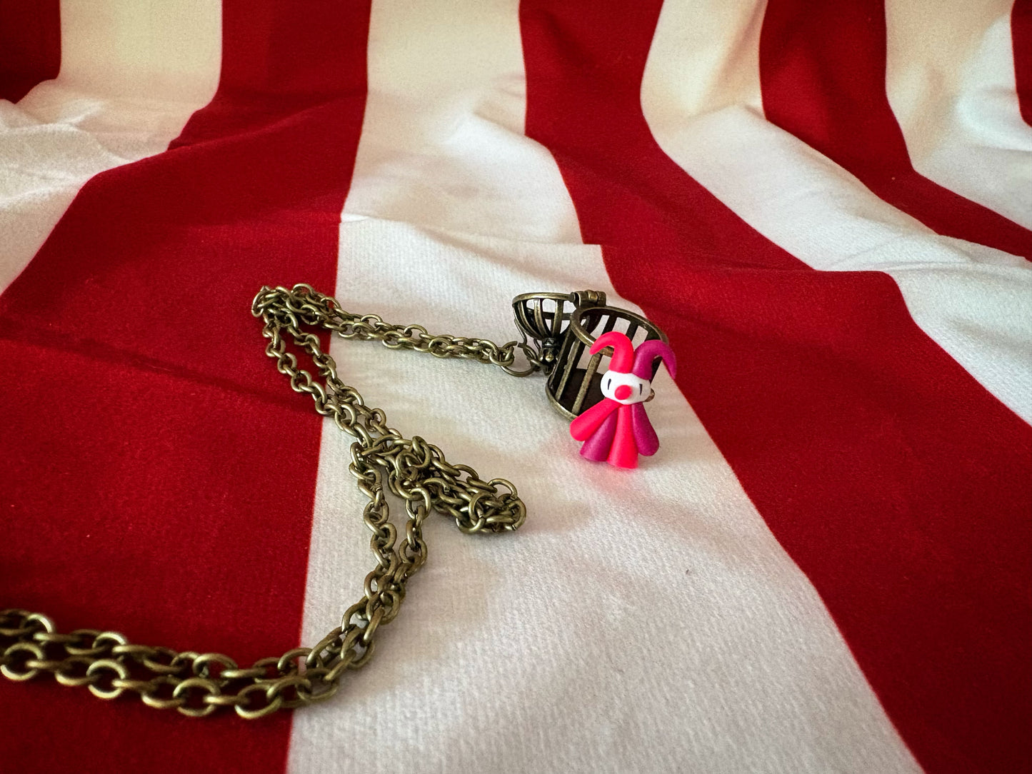 Tiny Caged Clown Necklace