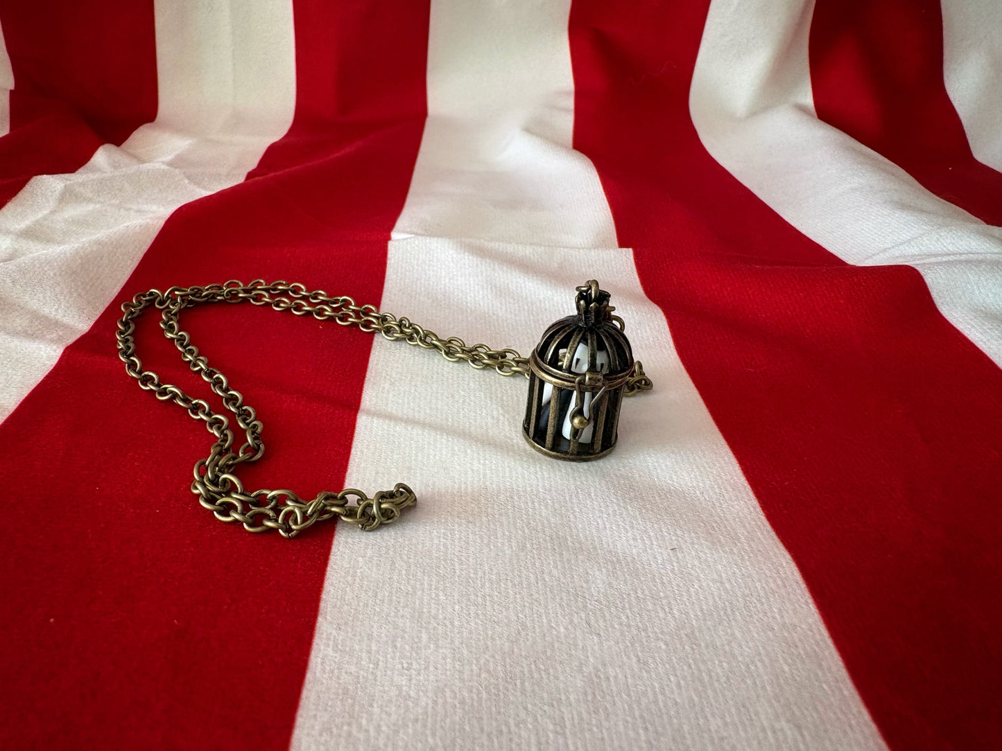 Tiny Caged Clown Necklace