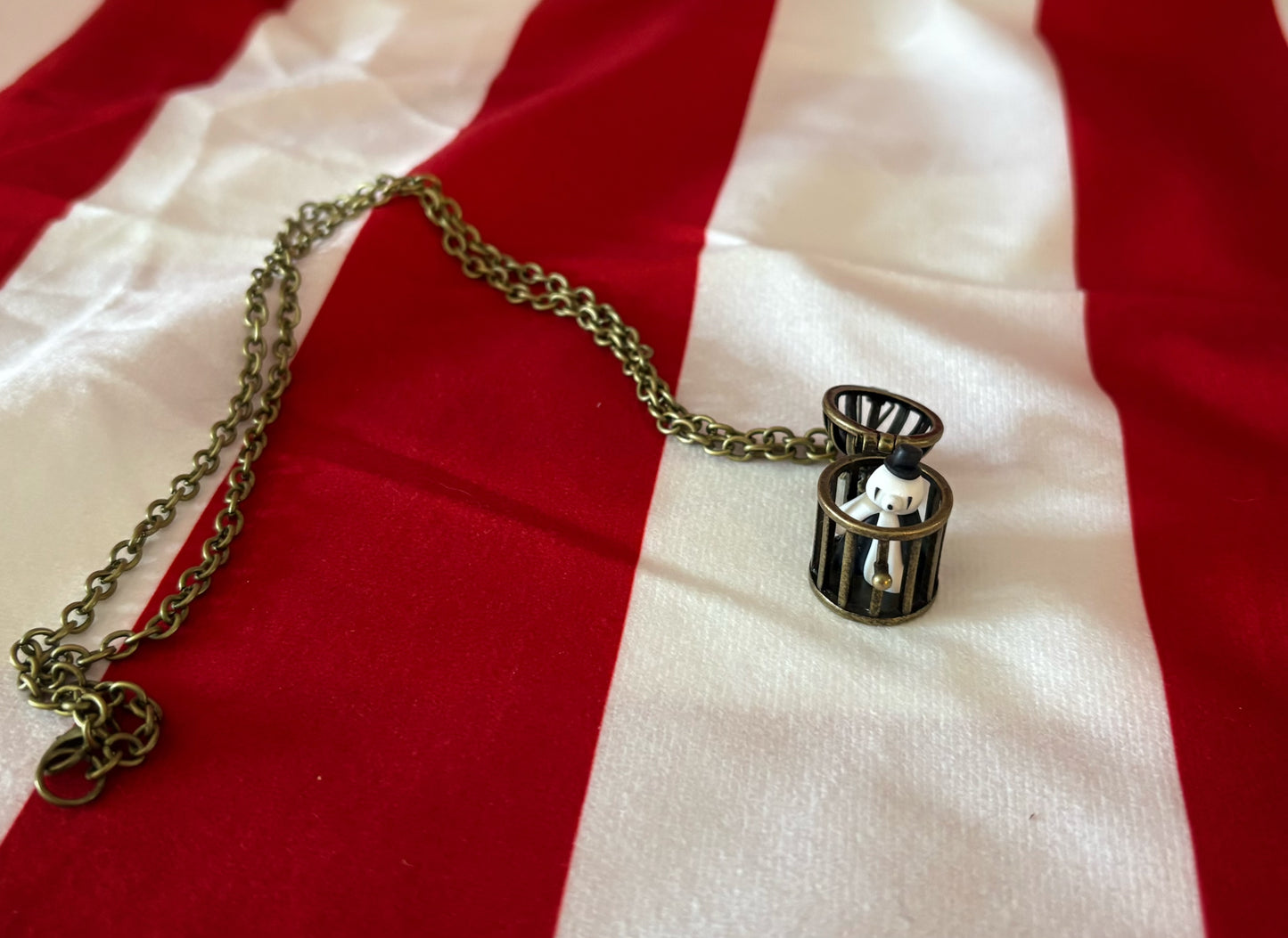 Tiny Caged Clown Necklace